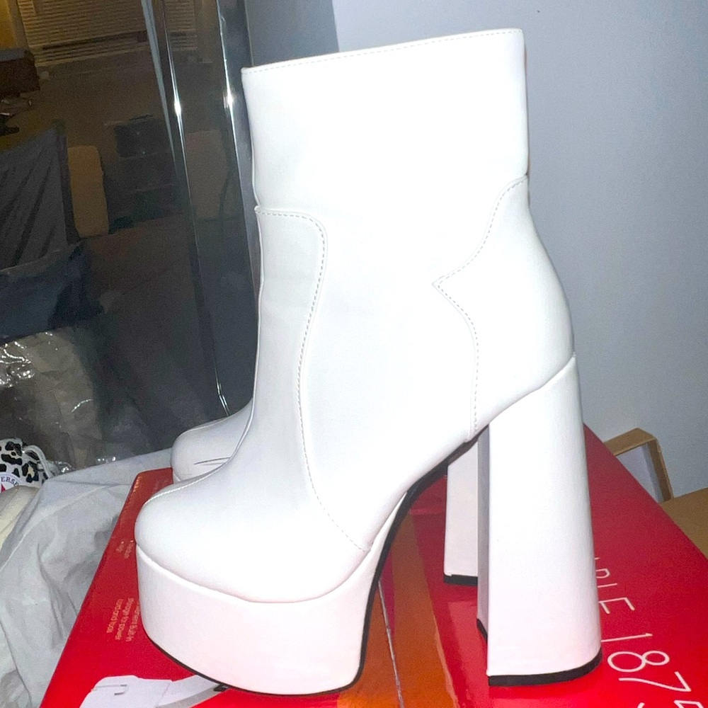 White Tall chunky go-go boots.